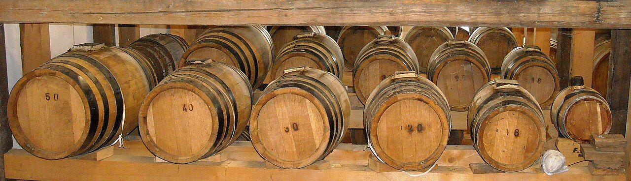 Balsamic vinegar aging in wooden barrel 