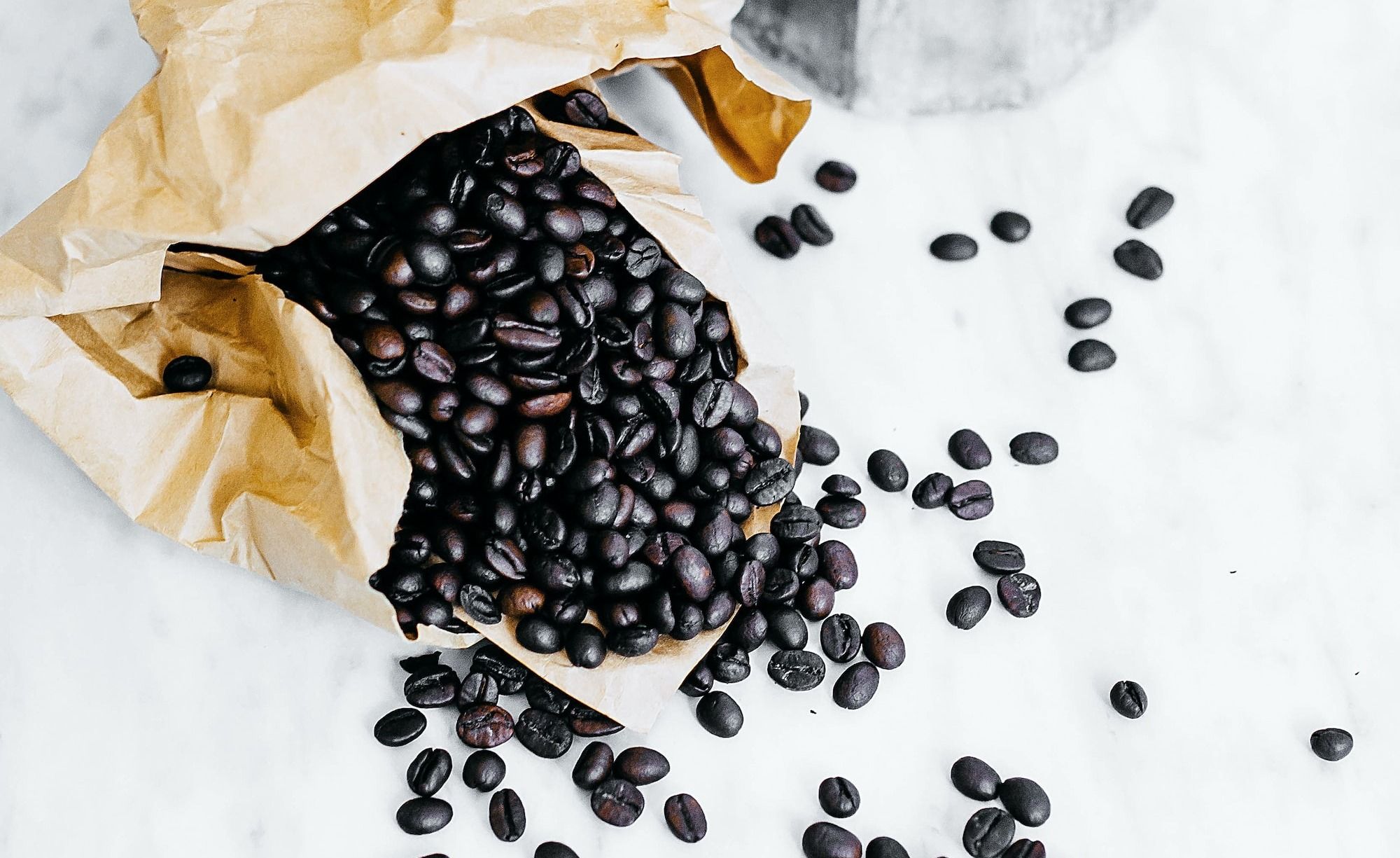 black coffee beans and gray mocha pot