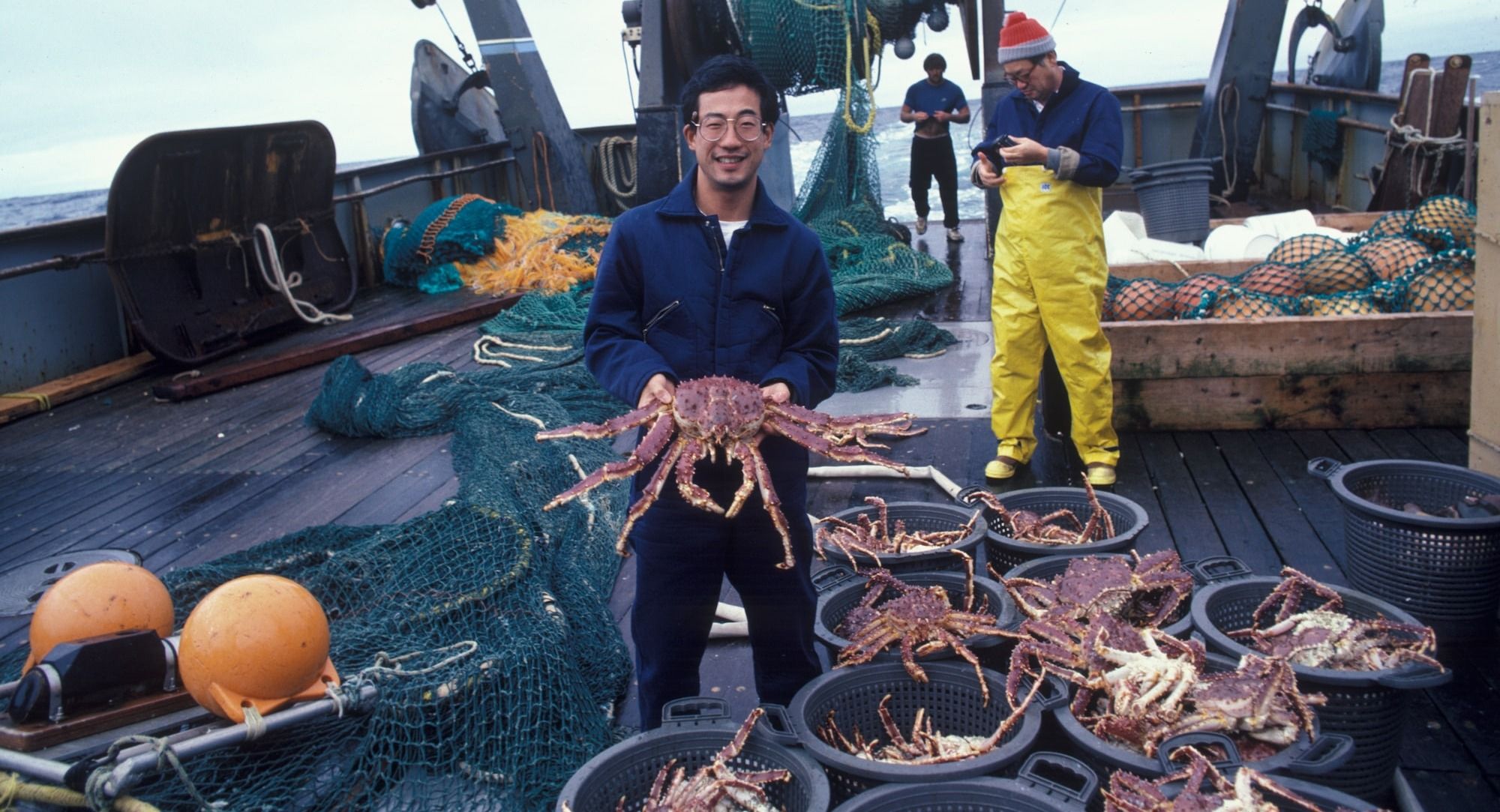 man holding brown crab
