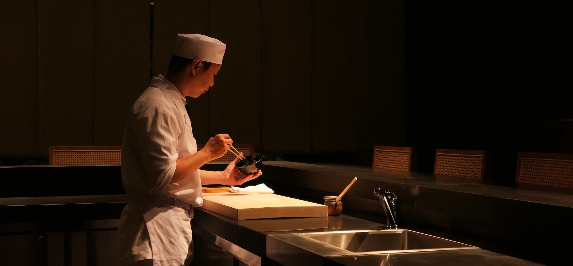 Japanese chef in the kitchen preparing dishes
