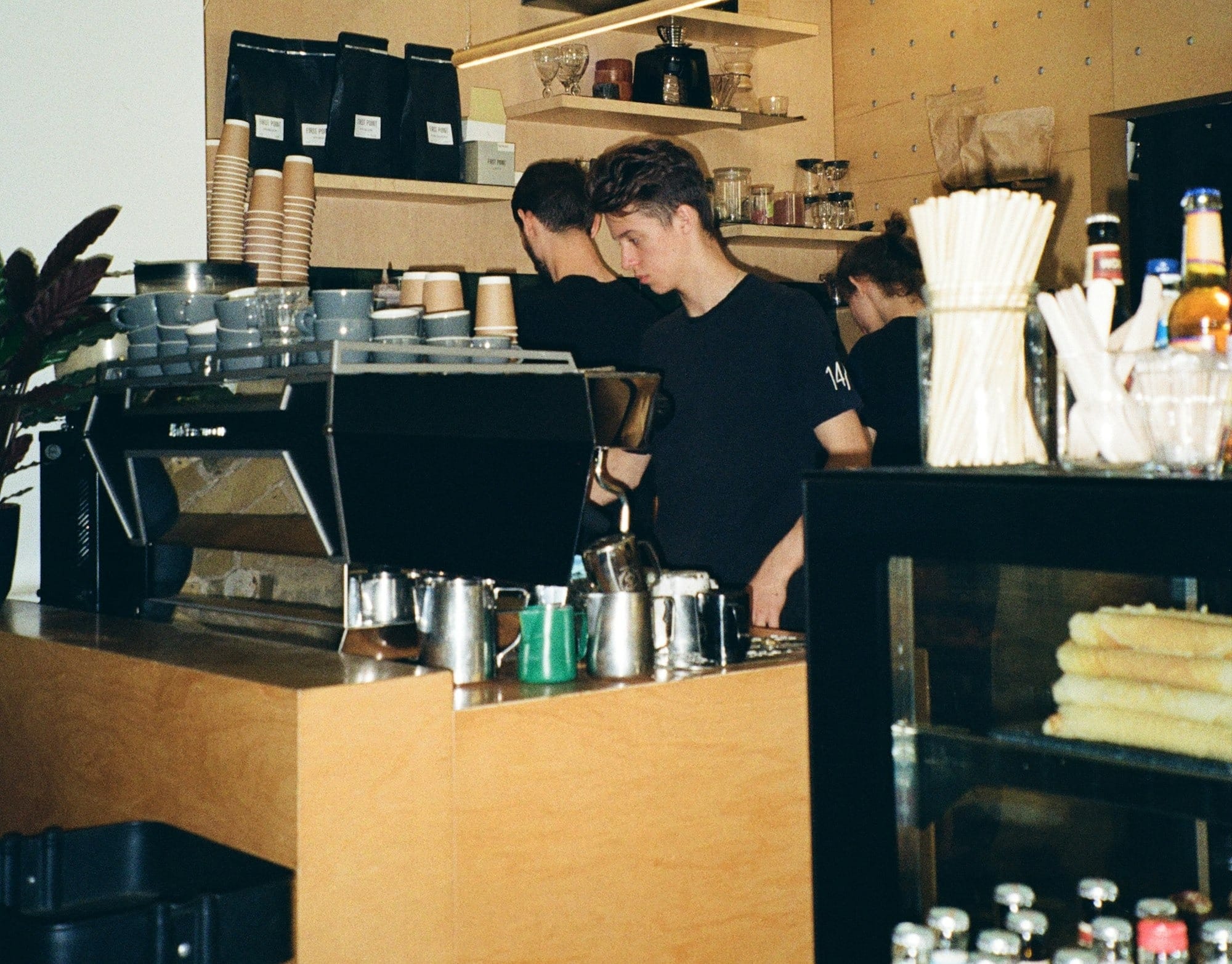 a man standing behind a counter in a store