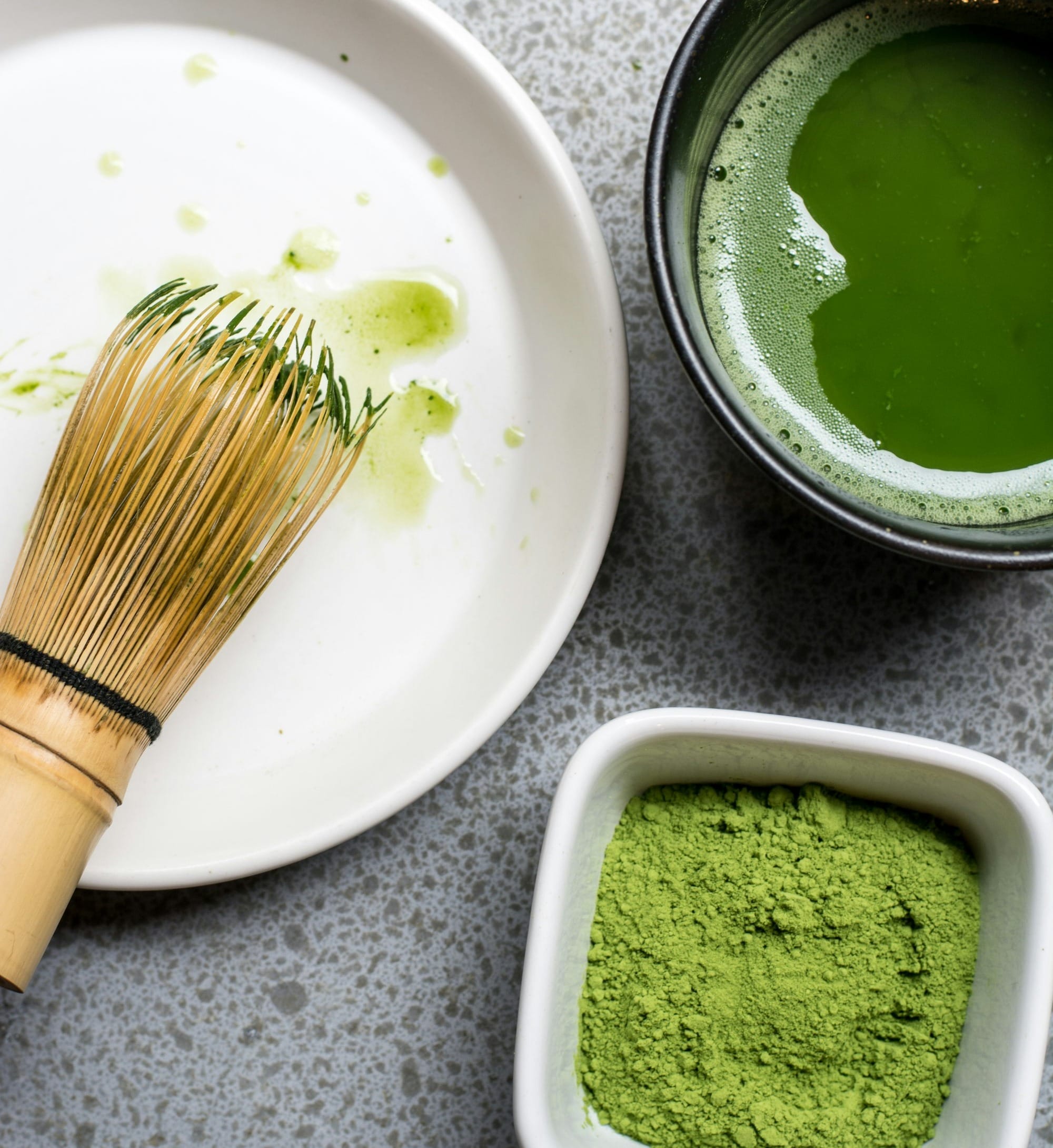 green powder in white bowl