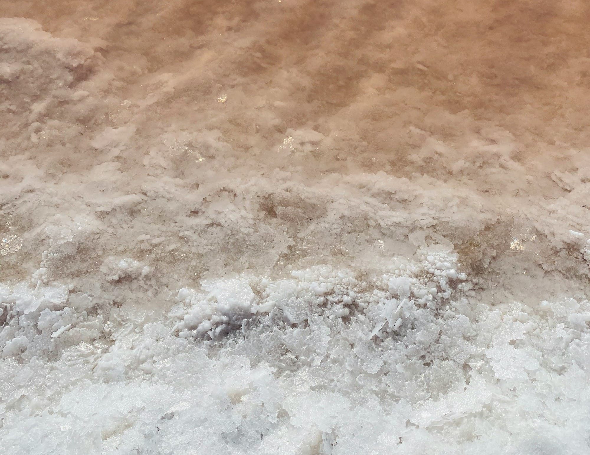 water waves on brown sand